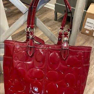 Cute red tote! 9 inches tall and 15 inches wide. No signs of wear.